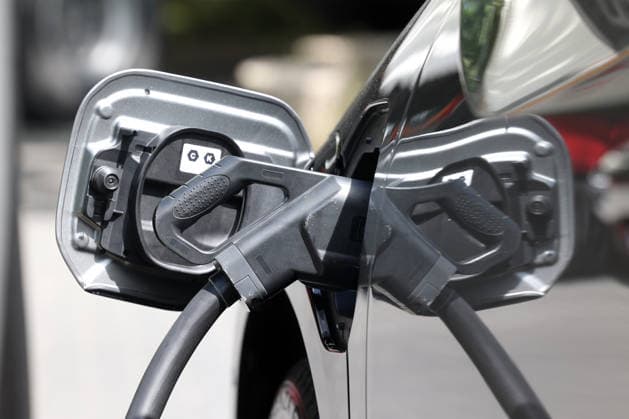An electric vehicle is being charged. The charging cable is plugged into the car. Electric mobility on July 7, 2026, in Siegen, Germany