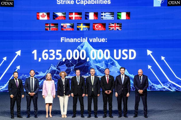 July 7, 2026, Ankara, Turkiye, Turkiye: NATO Deputy Secretary General RADMILA SEKERINSKA (4th L) stands on stage with international defence officials and military commanders in front of a digital screen displaying a total contract value of 1,635,000,000 USD during the Strike Capabilities announcement at the NATO Summit Defence Industry Forum at the ATO Congresium. The multi-billion-dollar framework, representing one of three flagship industrial pillars alongside Space and Surveillance and Integrated Air and Missile Defence, coordinates precision munitions and missile production across an eleven-nation coalition involving defence firms Diehl and Roketsan. Ankara Turkiye  - ZUMAo116 20260707_znp_o116_027 Copyright: xBiancaxOterox