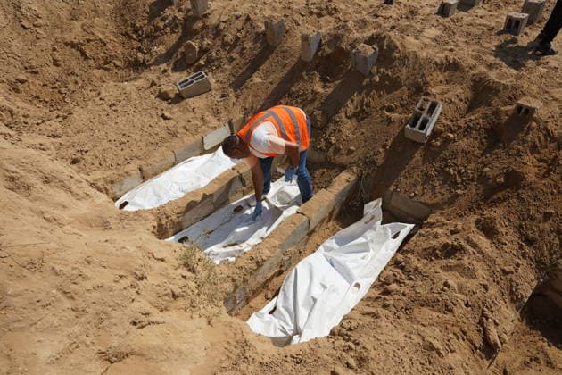 Red Cross teams examined the mass grave in the Deir al-Balah DEIR AL-BALAH, GAZA, PALESTINE - JULY 7: Officials of the International Committee of the Red Cross (ICRC) continue their work at a mass grave to collect samples from bodies for DNA testing during an investigation for unidentified victims of Israeli attacks in Deir al-Balah, Gaza, Palestine on July 07, 2026. Anas Zeyad Fteha Anadolu Deir al-Balah Gaza. Editorial use only. Please get in touch for any other usage.  Copyright: x2026xAnadoluxAnasxZeyadxFtehax