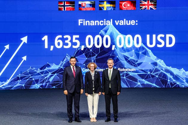 July 7, 2026, Ankara, Turkiye, Turkiye: Roketsan CEO MURAT IKINCI (L), NATO Deputy Secretary General RADMILA SEKERINSKA (C), and President of the Turkish Secretariat of Defence Industries HALUK GORGUN (R) stand together on stage before a digital screen displaying a total contract value of 1,635,000,000 USD during the Strike Capabilities segment of the NATO Summit Defence Industry Forum (NSDIF) at the ATO Congresium. Ankara Turkiye - ZUMAo116 20260707_znp_o116_030 Copyright: xBiancaxOterox