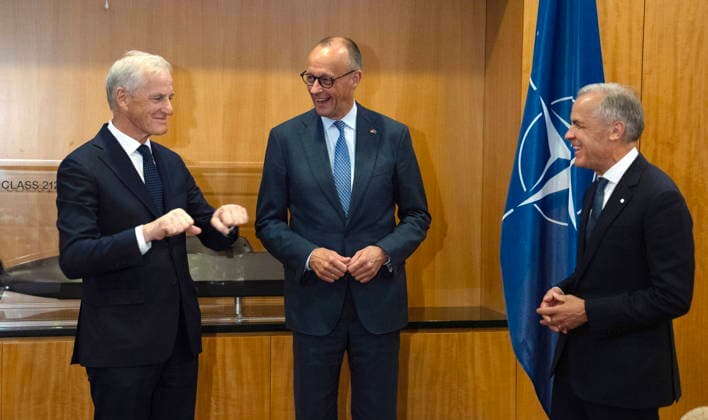 July 7, 2026, Ankara, Turkey: Norwegian Prime Minister Jonas Gahr Store, left, demonstrates the Viking Row as Prime Minister Mark Carney, right, and German Chancellor Friedrich Merz react after Carney referenced a trade for Norwegian soccer player Erling Haaland before a meeting in Ankara, Turkey, Tuesday, July 7, 2026. Ankara Turkey  - ZUMAc35_ 20260707_zaf_c35_101 Copyright: xAdrianxWyldx