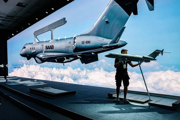 July 7, 2026, Ankara, Turkiye, Turkiye: An exhibition worker removes a scale model of the Saab GlobalEye Airborne Early Warning and Control (AEW&C) aircraft from its stand as disassembly begins following the conclusion of the NATO Summit Defence Industry Forum (NSDIF) at the ATO Congresium. The specialized industry exhibition closed after a historic session that saw alliance member nations and global aerospace executives finalize more than 70 billion USD in combined transatlantic defence procurement contracts, joint manufacturing agreements, and strategic capability frameworks. Ankara Turkiye  - ZUMAo116 20260707_znp_o116_068 Copyright: xBiancaxOterox