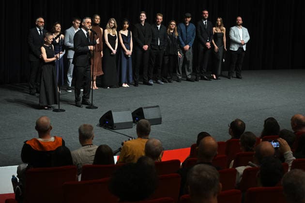 The 60th Karlovy Vary International Film Festival continued on its fifth day, in Karlovy Vary, Czech Republic, on July 7, 2026. A delegation of filmmakers presented the competition film Three Weeks Later (Serbia, Bulgaria, Italy, Croatia, Luxembourg) in the Grand Ballroom of the Thermal Hotel. Director Miroslav Terzic is standing backward left (wearing glasses and a goatee beard), in front of him stands interpreter of the Karlovy Vary Festival Helena Koutna, to microphone speaks producer Branislav Trifunovic. (CTKxPhoto SlavomirxKubes) CTKPhotoP2026070709546  CTKPhotoP2026070709546