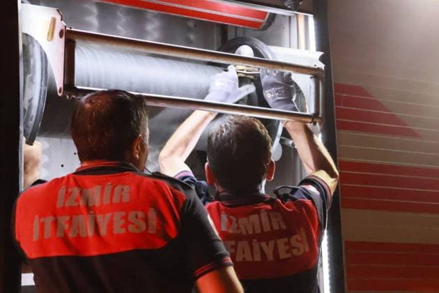 Grass Fire Near Homes Quickly Contained in Izmir IZMIR, TURKEY JULY 2026: Firefighters respond to a grass fire that broke out on elevated ground in the Ä°mariye neighborhood of Konak district in Izmir, Turkey, on the evening of July 2026. The blaze erupted at approximately 8:30 p.m. in an area located close to residential buildings, prompting concern among local residents who alerted emergency services. The fire spread from the hilltop toward a nearby road intersection before firefighters brought the situation under control. An employee of the Izmir Metropolitan Municipality also assisted efforts to extinguish the flames using available equipment. No injuries or damage to nearby homes were immediately reported. Ä°zmir Türkiye Copyright: x xTurgayxKÄ±lÄ±cx xJNAxPressx