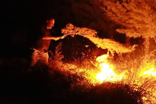 Grass Fire Near Homes Quickly Contained in Izmir IZMIR, TURKEY JULY 2026: Firefighters respond to a grass fire that broke out on elevated ground in the Ä°mariye neighborhood of Konak district in Izmir, Turkey, on the evening of July 2026. The blaze erupted at approximately 8:30 p.m. in an area located close to residential buildings, prompting concern among local residents who alerted emergency services. The fire spread from the hilltop toward a nearby road intersection before firefighters brought the situation under control. An employee of the Izmir Metropolitan Municipality also assisted efforts to extinguish the flames using available equipment. No injuries or damage to nearby homes were immediately reported. Ä°zmir Türkiye Copyright: x xTurgayxKÄ±lÄ±cx xJNAxPressx