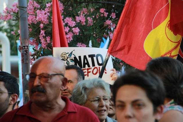 IZMIR, Türkiye July 7, 2026: Demonstrators march toward NATO s Allied Land Command (LANDCOM) headquarters in the Buca district of Ä°zmir during an anti-NATO protest organized by the NATO ya HayÄ±r Koordinasyonu (No to NATO Coordination), a coalition of left-wing political parties, trade unions and civil society organizations, ahead of the NATO Summit in Ankara, July 7, 2026. Police closed Mehmet Akif Avenue to traffic and deployed extensive security measures as protesters carried placards reading Trump, Netanyahu, you are not welcome and Yankee Go Home before delivering a public statement criticizing NATO and Turkish government policies outside the headquarters. Ä°zmir Türkiye Copyright: x xNagihanxÃ‡akÄ±rx xJNAxPressx