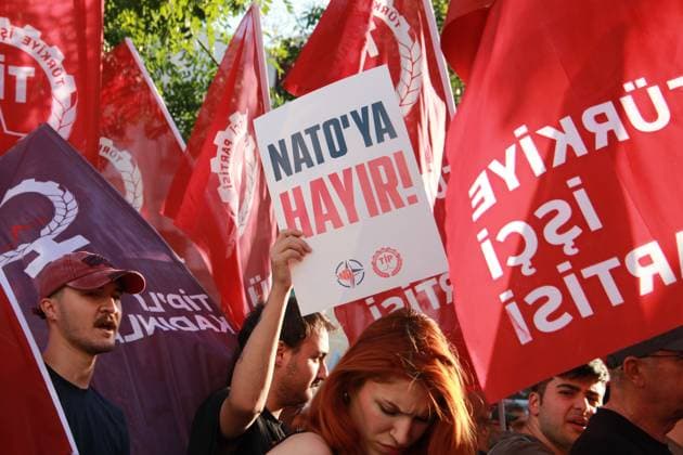 IZMIR, Türkiye July 7, 2026: Demonstrators march toward NATO s Allied Land Command (LANDCOM) headquarters in the Buca district of Ä°zmir during an anti-NATO protest organized by the NATO ya HayÄ±r Koordinasyonu (No to NATO Coordination), a coalition of left-wing political parties, trade unions and civil society organizations, ahead of the NATO Summit in Ankara, July 7, 2026. Police closed Mehmet Akif Avenue to traffic and deployed extensive security measures as protesters carried placards reading Trump, Netanyahu, you are not welcome and Yankee Go Home before delivering a public statement criticizing NATO and Turkish government policies outside the headquarters. Ä°zmir Türkiye Copyright: x xNagihanxÃ‡akÄ±rx xJNAxPressx