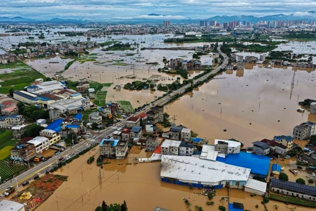 NANNING, CHINA - JULY 07: Houses and trees are submerged in flood waters after typhoon Maysak caused the Liulan Reservoir dam to breach on July 7, 2026 in Hengzhou, Nanning, Guangxi Zhuang Autonomous Region of China. Recent extreme rainstorms triggered by Typhoon Maysak, the 10th typhoon of the year, have caused severe flooding in parts of south China s Guangxi Zhuang Autonomous Region.  Copyright: xVCGx 111652913848