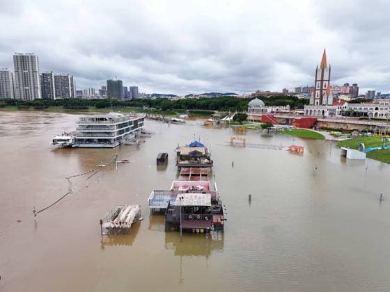 NANNING, CHINA - JULY 07: Floodwaters submerge riverside walkways and shops on July 7, 2026 in Nanning, Guangxi Zhuang Autonomous Region of China. Recent extreme rainstorms triggered by Typhoon Maysak, the 10th typhoon of the year, have caused severe flooding in parts of south China s Guangxi Zhuang Autonomous Region.  Copyright: xVCGx 111652813940