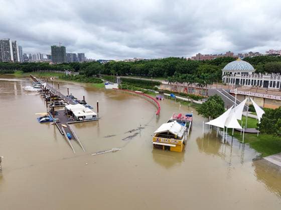 NANNING, CHINA - JULY 07: Floodwaters submerge riverside walkways and shops on July 7, 2026 in Nanning, Guangxi Zhuang Autonomous Region of China. Recent extreme rainstorms triggered by Typhoon Maysak, the 10th typhoon of the year, have caused severe flooding in parts of south China s Guangxi Zhuang Autonomous Region.  Copyright: xVCGx 111652813941