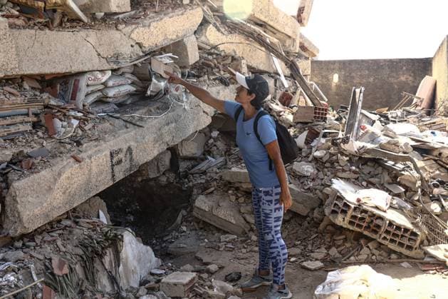 Aftermath of the Earthquake in Caraballeda, La Guaira, Venezuela CARABALLEDA, VENEZUELA JULY 7, 2026: Aura Milena Rodriguez stands among the ruins of her destroyed home in Caraballeda, La Guaira, as she searches for any trace of her son, JosÃ Miguel Gonzalez Rodriguez, 25, a Spanish citizen who has been missing since the powerful earthquakes struck Venezuela on June 24. Accompanied by rescue teams, Rodriguez returned to the collapsed building where her son was last seen, clinging to hope as search and recovery operations continue. Spanish authorities have confirmed the deaths of 35 Spanish citizens, while 140 others remain missing, including JosÃ Miguel. The earthquakes have killed at least 3,685 people, displaced nearly 18,000 re Copyright: x xLauraxdexChiclanax xJNAxPressx