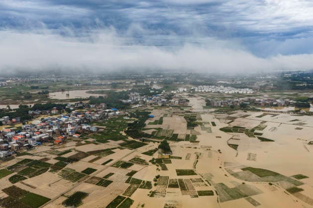 NANNING, CHINA - JULY 07: Floodwaters submerge fields of Linjiang village on July 7, 2026 in Hengzhou, Nanning, Guangxi Zhuang Autonomous Region of China. Recent extreme rainstorms triggered by Typhoon Maysak, the 10th typhoon of the year, have caused severe flooding in parts of south China s Guangxi Zhuang Autonomous Region.  Copyright: xVCGx 111652981417