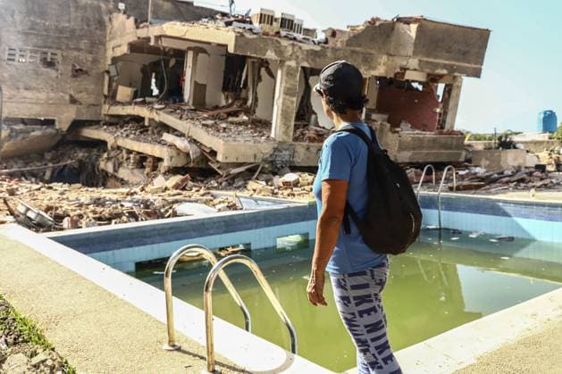 Aftermath of the Earthquake in Caraballeda, La Guaira, Venezuela CARABALLEDA, VENEZUELA JULY 7, 2026: Aura Milena Rodriguez stands among the ruins of her destroyed home in Caraballeda, La Guaira, as she searches for any trace of her son, JosÃ Miguel Gonzalez Rodriguez, 25, a Spanish citizen who has been missing since the powerful earthquakes struck Venezuela on June 24. Accompanied by rescue teams, Rodriguez returned to the collapsed building where her son was last seen, clinging to hope as search and recovery operations continue. Spanish authorities have confirmed the deaths of 35 Spanish citizens, while 140 others remain missing, including JosÃ Miguel. The earthquakes have killed at least 3,685 people, displaced nearly 18,000 re Copyright: x xLauraxdexChiclanax xJNAxPressx