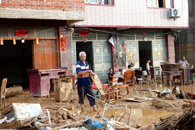 NANNING, CHINA - JULY 07: A villager dries furniture in front of his house on July 7, 2026 in Hengzhou, Nanning, Guangxi Zhuang Autonomous Region of China. Recent extreme rainstorms triggered by Typhoon Maysak, the 10th typhoon of the year, have caused severe flooding in parts of south China s Guangxi Zhuang Autonomous Region.  Copyright: xVCGx 111652981460