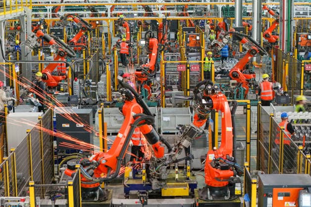 JINHUA, CHINA - JULY 07: Industrial robots process new energy vehicle parts at the intelligent production workshop of Zhejiang Zhixin Technology Co., Ltd. on July 7, 2026 in Jinhua, Zhejiang Province of China. The workshop is dedicated to the production of components for new energy vehicles.  Copyright: xVCGx 111652834354