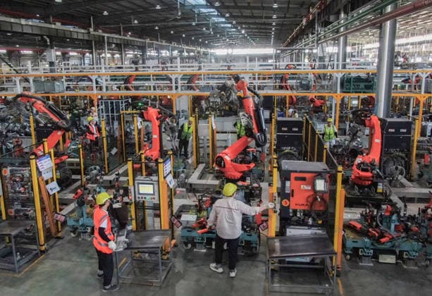 JINHUA, CHINA - JULY 07: Industrial robots process new energy vehicle parts at the intelligent production workshop of Zhejiang Zhixin Technology Co., Ltd. on July 7, 2026 in Jinhua, Zhejiang Province of China. The workshop is dedicated to the production of components for new energy vehicles.  Copyright: xVCGx 111652845285