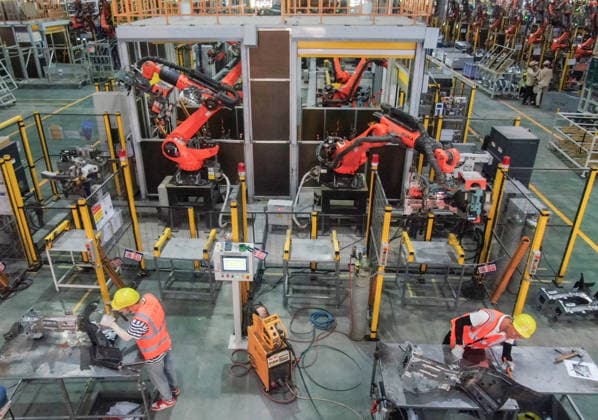 JINHUA, CHINA - JULY 07: Industrial robots process new energy vehicle parts at the intelligent production workshop of Zhejiang Zhixin Technology Co., Ltd. on July 7, 2026 in Jinhua, Zhejiang Province of China. The workshop is dedicated to the production of components for new energy vehicles.  Copyright: xVCGx 111652845284
