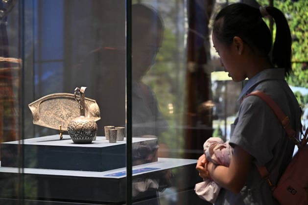 TAIYUAN, CHINA - JULY 08: Visitors view 19th-century Armenian silverware including trays, ewers and wine glasses at the Shanxi Museum on July 8, 2026 in Taiyuan, Shanxi Province of China. The exhibition titled Land of Noah features 134 sets of precious artifacts from the Yerevan History Museum in Armenia, marking their first large-scale display in Shanxi. The collection includes traditional costumes, silverware, musical instruments, carpets, embroidery, oil paintings and pottery.  Copyright: xChinaxNewsxServicex 111653053327