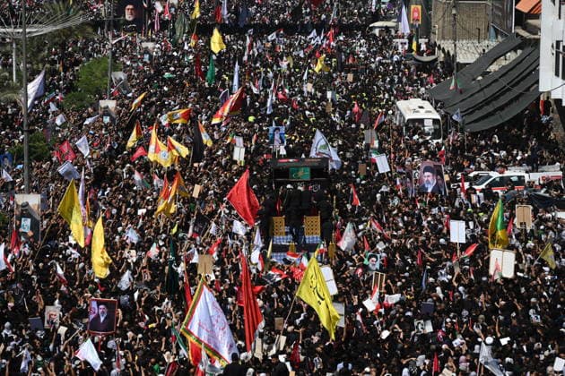 Thousands gather in Iraq for funeral procession of slain Iranian leader Khamenei NAJAF, IRAQ - JULY 8: A massive crowd of mourners carrying flags and posters fills the streets as the coffins of Iranian supreme leader Ali Khamenei and his family members are carried among the public inside a specially designed truck resembling the Imam Reza Shrine during a farewell ceremony in Najaf, Iraq, on July 8, 2026. Khamenei lost his life following joint US-Israeli attacks, drawing thousands to the squares and avenues since the early hours of the morning. Haidar Mohammed Ali Anadolu Najaf Iraq. Editorial use only. Please get in touch for any other usage.  Copyright: x2026xAnadoluxHaidarxMohammedxAlix