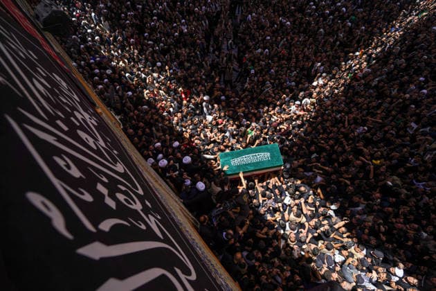 Farewell ceremony held for Iran s former leader Ali Khamenei in Najaf NAJAF, IRAQ - JULY 8: Large crowds carrying flags and posters attend the farewell ceremony held for former Iranian leader Ali Khamenei, who was killed in U.S.-Israeli attacks as in Najaf, Iran on July 8, 2026. The coffins of Khamenei and his family members are transported through the crowd in a specially designed truck after the Imam Reza Shrine before being brought to the Imam Ali Shrine. Karar Essa Anadolu Najaf Iraq. Editorial use only. Please get in touch for any other usage.  Copyright: x2026xAnadoluxKararxEssax