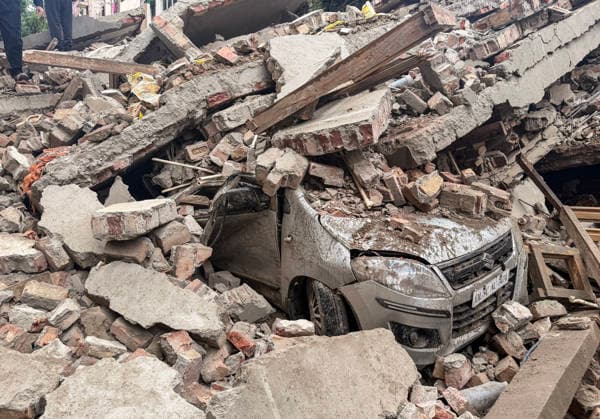 Under-Construction Building Collapses in New Delhi s Rohini Sector 16 New Delhi, Jul 08 (ANI): A view of a damaged vehicle trapped under the piles of rubble after an under-construction building collapsed at Rohini s Sector 16, in New Delhi on Wednesday. Firefighting and rescue operations underway. NEW DELHI Delhi India Copyright: xANIx ANI_20260708351