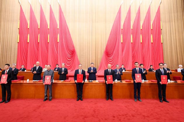 (260708) -- BEIJING, July 8, 2026 -- Xi Jinping and other leaders of the Communist Party of China and the state, together with the two winners of the national top sci-tech award, present certificates to representatives of recipients of the State Natural Science Award, the State Technological Invention Award, the State Scientific and Technological Progress Award and the China International Science and Technology Cooperation Award at the Great Hall of the People in Beijing, capital of China, July 8, 2026. A meeting bringing together the national science and technology award conference, the general assemblies of the members of the Chinese Academy of Sciences (CAS) and the Chinese Academy of Engineering (CAE), and the 11th national congress of 