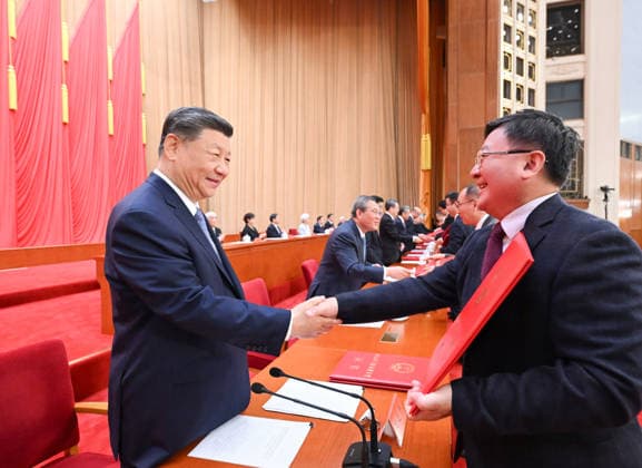 (260708) -- BEIJING, July 8, 2026 -- Xi Jinping and other leaders of the Communist Party of China and the state, together with the two winners of the national top sci-tech award, present certificates to representatives of recipients of the State Natural Science Award, the State Technological Invention Award, the State Scientific and Technological Progress Award and the China International Science and Technology Cooperation Award at the Great Hall of the People in Beijing, capital of China, July 8, 2026. A meeting bringing together the national science and technology award conference, the general assemblies of the members of the Chinese Academy of Sciences (CAS) and the Chinese Academy of Engineering (CAE), and the 11th national congress of 
