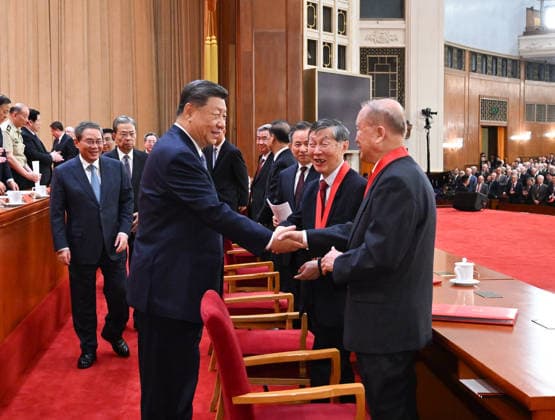 (260708) -- BEIJING, July 8, 2026 -- Chinese President Xi Jinping, also general secretary of the Communist Party of China Central Committee and chairman of the Central Military Commission, talks with the two national top sci-tech award winners Chen Liquan, a researcher at the Institute of Physics under the Chinese Academy of Sciences (CAS) and a Chinese Academy of Engineering (CAE) academician, and Ben De, a researcher at the China Electronics Technology Group Corporation and also a CAE academician, after a meeting bringing together the national science and technology award conference, the general assemblies of the members of the CAS and the CAE, and the 11th national congress of the China Association for Science and Technology at the Grea 