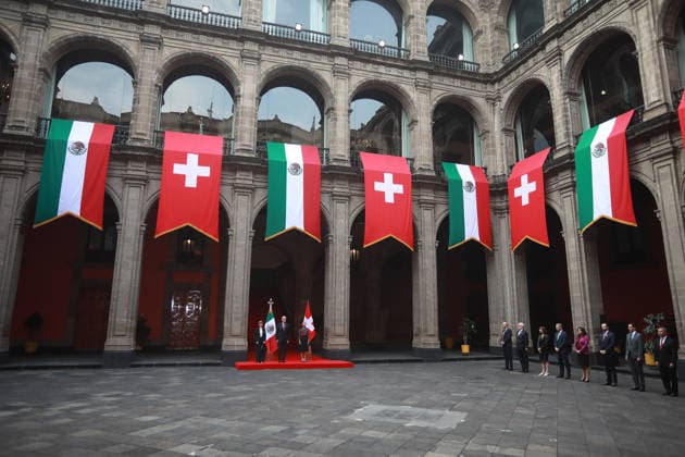 Swiss President Guy Parmelin in Mexico MEXICO CITY, MEXICO - JULY 08: Swiss President Guy Parmelin (C) accompanied by his wife Caroline Merotto (L) is received by Mexico s President Claudia Sheinbaum (R) during a welcome ceremony, at the National Palace, in Mexico City, Mexico on July 08, 2026. The visit of Swiss President Guy Parmelin to Mexico aims to strengthen bilateral economic and trade relations, as well as to promote new investment opportunities between both nations and advance the modernization of the EFTA free trade agreement. Daniel Cardenas Anadolu Mexico City Mexico. Editorial use only. Please get in touch for any other usage.  Copyright: x2026xAnadoluxDanielxCardenasx