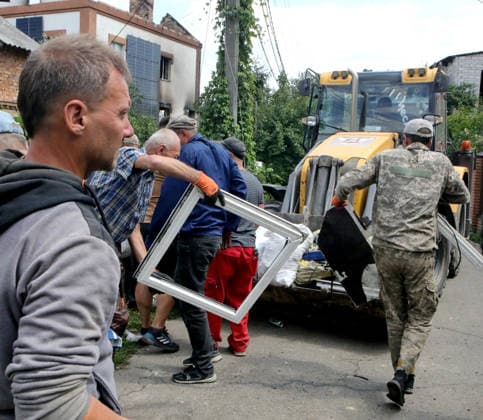 RECORD DATE NOT STATED Men clear debris and building rubble following the overnight Russian attack of July 6, Vyshneve, Kyiv region, Ukraine, on July 7, 2026. Russian forces launched a massive attack on Kyiv and the surrounding region using various types of missiles and attack drones. According to the State Emergency Service of Ukraine, seven people were killed in Vyshneve. Residential development on five streets was completely destroyed, while warehouses and businesses sustained damage. More than 600 local residents were evacuated because of the risk posed by unexploded ordnance (Photo by Volodymyr Tarasov Ukrinform) Aftermath of Russian attack and secondary explosions cleared in Vyshneve  Copyright: xVolodymyrxTarasovx