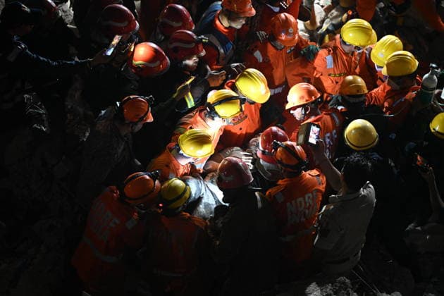 NEW DELHI, INDIA - JULY 8: NDRF personnel rescue a survivor trapped under the debris after a building collapsed in G Block, Sector 16, Rohini on July 8, 2026 in New Delhi, India. Rescue operations were launched immediately, with multiple emergency agencies deployed to search for and evacuate those trapped beneath the rubble. (Photo by Ishant Chauhan Hindustan Times) Man Killed As Under-Construction Building Collapses In Delhi s Rohini Sector 16
