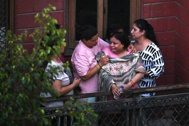 NEW DELHI, INDIA - JULY 8: Family members mourn outside the site where a building collapsed in G Block, Sector 16, Rohini on July 8, 2026 in New Delhi, India. Rescue operations by the NDRF and other emergency agencies continued as authorities searched the debris for survivors and assessed the cause of the collapse. (Photo by Sanchit Khanna Hindustan Times) Man Killed As Under-Construction Building Collapses In Delhi s Rohini Sector 16