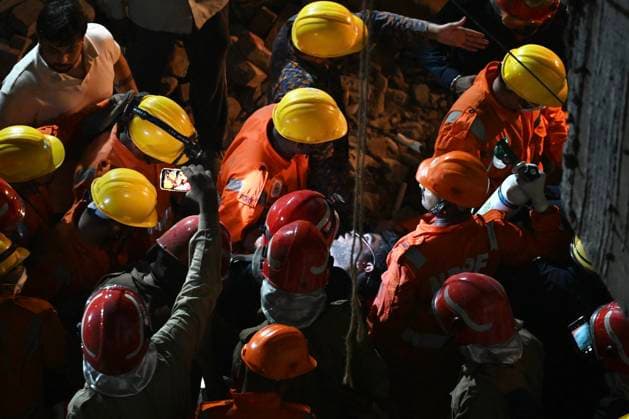NEW DELHI, INDIA - JULY 8: NDRF personnel rescue a survivor trapped under the debris after a building collapsed in G Block, Sector 16, Rohini on July 8, 2026 in New Delhi, India. Rescue operations were launched immediately, with multiple emergency agencies deployed to search for and evacuate those trapped beneath the rubble. (Photo by Sanchit Khanna Hindustan Times) Man Killed As Under-Construction Building Collapses In Delhi s Rohini Sector 16