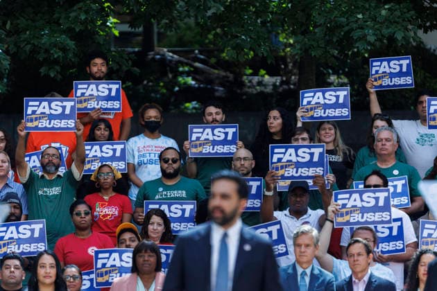 July 8, 2026, Brooklyn, New York, USA: Supporters are seen behind Mayor ZOHRAN MAMDANI as he addresses the crowd during a press conference to unveil a bus action plan on Wednesday. Mayor Zohran Mamdani and Governor Kathy Hochul unveiled Ã¢â‚¬ËœNext Stop Fast Buses, Better Service,Ã¢â‚¬â ¢ aimed at making services faster and more accessible, and announced partnerships with the New York City Department of Transportation (NYC DOT) and the Metropolitan Transportation Authority Brooklyn USA  - ZUMAh182 20260708_znp_h182_007 Copyright: xMatthewxHoenx