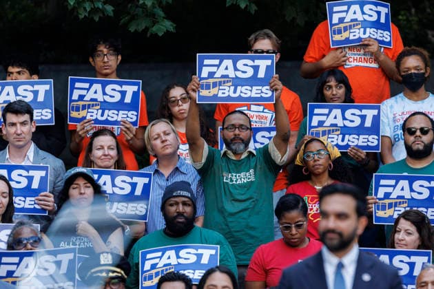 July 8, 2026, Brooklyn, New York, USA: Supporters are seen behind Mayor ZOHRAN MAMDANI during a press conference to unveil a bus action plan on Wednesday. Mayor Zohran Mamdani and Governor Kathy Hochul unveiled Ã¢â‚¬ËœNext Stop Fast Buses, Better Service,Ã¢â‚¬â ¢ aimed at making services faster and more accessible, and announced partnerships with the New York City Department of Transportation (NYC DOT) and the Metropolitan Transportation Authority Brooklyn USA - ZUMAh182 20260708_znp_h182_020 Copyright: xMatthewxHoenx