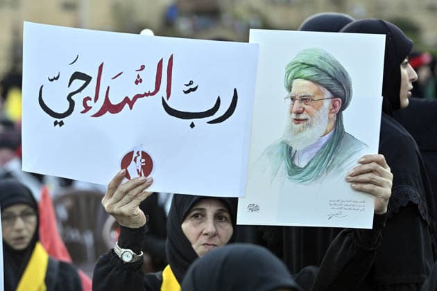 Symbolic funeral ceremony held in Beirut for Iran s late Supreme Leader Khamenei BEIRUT, LEBANON - JULY 8: People, holding photos of Khamenei, Lebanese and Iranian flags, and Hezbollah banners, attend a symbolic funeral ceremony for Iran s late Supreme Leader Ayatollah Ali Khamenei in Dahieh district of Beirut, Lebanon on July 8, 2026. Houssam Shbaro Anadolu Beirut Lebanon. Editorial use only. Please get in touch for any other usage.  Copyright: x2026xAnadoluxHoussamxShbarox
