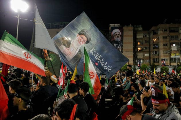 July 8, 2026, Beirut, Beirut, Lebanon: Pro-Iranian Hezbollah supporters wave the party flags, Iranian flags and flags bearing the image of assassinated Iranian Supreme Leader Ayatollah Ali Khamenei during a memorial ceremony mourning the Iranian slain leader in Beirut southern suburb. Iran began six days of public funeral ceremonies for Khamenei on July 4, including a dedicated day to neighboring Iraq, a Shia powerhouse with close ties to Tehran. Beirut Lebanon - ZUMAn313 20260708_zip_n313_013 Copyright: xMarwanxNaamanix