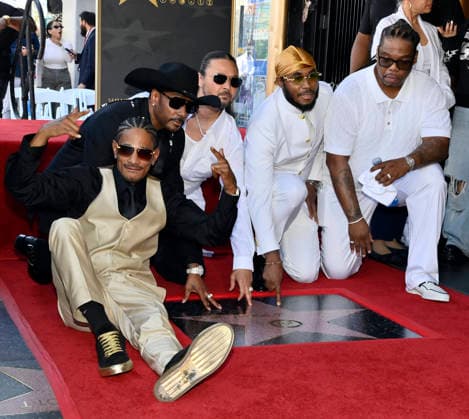 Layzie Bone, Krayzie Bone, Bizzy Bone, Flesh-n-Bone and Wish Bone (L-R) of the Hip-Hop group Bone Thugs-N-Harmony gather around their star during a ceremony honoring them with the 2,851st star on the Hollywood Walk of Fame in Los Angeles on Wednesday, July 8, 2026.  LAP2026070802 JIMxRUYMEN