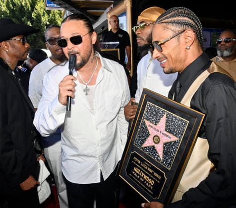 Bizzy Bone (L) and Layzie Bone of the Hip-Hop group Bone Thugs-N-Harmony speak with reporters during a ceremony honoring them with the 2,851st star on the Hollywood Walk of Fame in Los Angeles on Wednesday, July 8, 2026.  LAP2026070825 JIMxRUYMEN