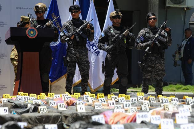 Salvadoran Security Authorities Present Seized Drug Shipment LA PAZ, EL SALVADOR - JULY 08: Police officers guarding packages of drugs marked as evidence during the presentation of a drug shipment seized at sea by Salvadoran security authorities, at the Port Captaincy of La Concordia on the Costa del Sol, La Paz, El Salvador on July 08, 2026. Salvadoran President Nayib Bukele reported on his social media that on June 18, members of the Salvadoran National Navy seized 6.68 tons of drugs more than 600 nautical miles offshore, valued at $167 million. Alex Pena Anadolu La Paz El Salvador. Editorial use only. Please get in touch for any other usage.  Copyright: x2026xAnadoluxAlexxPenax