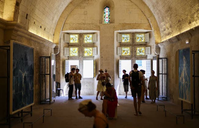 (260709) -- ARLES, July 9, 2026 -- People view exhibits during an exhibition at the Rencontres d Arles photography festival in Arles, France, July 8, 2026. The 57th Rencontres d Arles photography festival lasts from July 6 to October 4. ) FRANCE-ARLES-RENCONTRES D ARLES-PHOTOGRAPHY FESTIVAL-EXHIBITION WuxHuiwo 