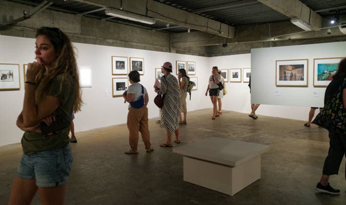 (260709) -- ARLES, July 9, 2026 -- People view exhibits during an exhibition at the Rencontres d Arles photography festival in Arles, France, July 8, 2026. The 57th Rencontres d Arles photography festival lasts from July 6 to October 4. ) FRANCE-ARLES-RENCONTRES D ARLES-PHOTOGRAPHY FESTIVAL-EXHIBITION WuxHuiwo 