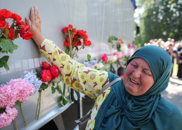 Ten newly identified victims of Srebrenica massacre will be buried on massacre anniversary A woman stands next to a truck carrying remains of the identified victims of the 1995 Srebrenica massacre to the Memorial centre in Potocari, where they will be buried on July 11, in Visoko, Bosnia and Herzegovina, July 09, 2026.  ArminxDurgut PIXSELL
