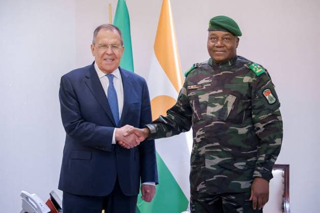 NIGER, NIAMEY - JULY 8, 2026: Russia s Foreign Minister Sergei Lavrov (L) and Niger s President Abdourahamane Tchiani shake hands during a meeting. Russian Foreign Ministry Press Service TASS  94851787