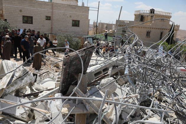 Israeli forces demolish home in southern West Bank town of Yatta Israeli forces demolish the two-story home of Palestinian resident Iyad Musleh al-Amour in the Khallet al-Miyeh area, east of the town of Yatta, south of Hebron in the occupied West Bank, on July 9, 2026. The house was home to three families comprising 15 people. According to local residents, the demolition was carried out on the grounds that the building lacked a permit, leaving the families displaced. Photo by Mamoun Wazwaz apaimages Hebron West Bank Palestinian Territory 090726_Hebron_MW_00(29) Copyright: xapaimagesxMamounxWazwazx xapaimagesx