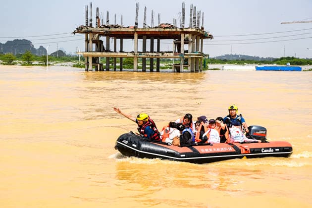 (260709) -- NANNING, July 9, 2026 -- Rescuers evacuate trapped students in Guigang City, south China s Guangxi Zhuang Autonomous Region, July 9, 2026. Recent extreme rainstorms triggered by Typhoon Maysak, the 10th typhoon of the year, have caused severe flooding in parts of Guangxi in the Pearl River basin. Guangxi is continuing its search and rescue operations for missing persons, enhancing resettlement services for affected residents and advancing post-disaster reconstruction. ) FOCUS Guangxi makes all-out rescue, relief efforts after rain-triggered disasters CaoxYiming 