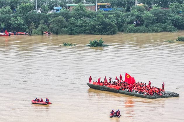 (260709) -- NANNING, July 9, 2026 -- An aerial drone photo shows rescuers evacuating trapped students in Guigang City, south China s Guangxi Zhuang Autonomous Region, July 9, 2026. Recent extreme rainstorms triggered by Typhoon Maysak, the 10th typhoon of the year, have caused severe flooding in parts of Guangxi in the Pearl River basin. Guangxi is continuing its search and rescue operations for missing persons, enhancing resettlement services for affected residents and advancing post-disaster reconstruction. ) FOCUS Guangxi makes all-out rescue, relief efforts after rain-triggered disasters CaoxYiming 