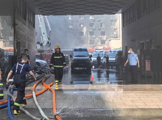 (260709) -- JINJIANG, July 9, 2026 -- Rescue forces work after a fire broke out at a footwear factory in Jiangtou Village, Chendai Township of Jinjiang City, southeast China s Fujian Province, on July 9, 2026. A fire hit a footwear factory in Fujian, with several people reported trapped or missing, local authorities said Thursday. Firefighting was still underway, with multiple fire trucks and ambulances on standby at the scene. China s Ministry of Emergency Management, together with the National Fire and Rescue Administration, has dispatched a joint work team to Jinjiang City to guide rescue and response efforts following the accident. ) (SpotNews) CHINA-FUJIAN-JINJIANG-FOOTWEAR FACTORY FIRE (CN) ZhengxLiang 