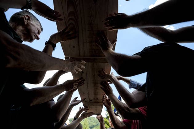 Column with the coffins of ten victims of the Srebrenica genocide has arrived in Potocari POTOCARI, BOSNIA AND HERZEGOVINA - JULY 09: People carry coffins containing the remains of victims of the 1995 Srebrenica genocide upon their arrival at the Memorial Center as family members and friends gather at the former Battery Factory to pay their respects to those who will be laid to rest during a collective funeral on July 11 in Potocari, Bosnia and Herzegovina, on July 09, 2026. Samir Jordamovic Anadolu Potocari Bosnia and Herzegovina. Editorial use only. Please get in touch for any other usage.  Copyright: x2026xAnadoluxSamirxJordamovicx