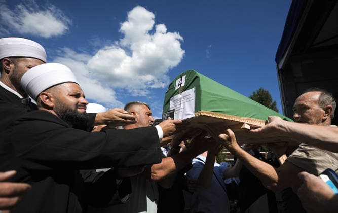 Column with the coffins of ten victims of the Srebrenica genocide has arrived in Potocari POTOCARI, BOSNIA AND HERZEGOVINA - JULY 09: People carry coffins containing the remains of victims of the 1995 Srebrenica genocide upon their arrival at the Memorial Center as family members and friends gather at the former Battery Factory to pay their respects to those who will be laid to rest during a collective funeral on July 11 in Potocari, Bosnia and Herzegovina, on July 09, 2026. Samir Jordamovic Anadolu Potocari Bosnia and Herzegovina. Editorial use only. Please get in touch for any other usage.  Copyright: x2026xAnadoluxSamirxJordamovicx